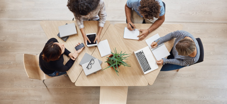 view-from-business-startup-teamwork-concept-startup-partners-sitting-coworking-space-talking-about-future-project-looking-through-examples-work-laptop-digital-tablet Large.jpeg